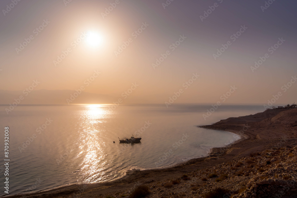 The alone fishing boat on the water of Dead Sea close to Israel coast (Ein Gedi) during the colorful sunset in the Middle East.
The alone fishing boat on the water of Dead Sea close to Israel coast (Ein Gedi) during the colorful sunset in the Middle East.
