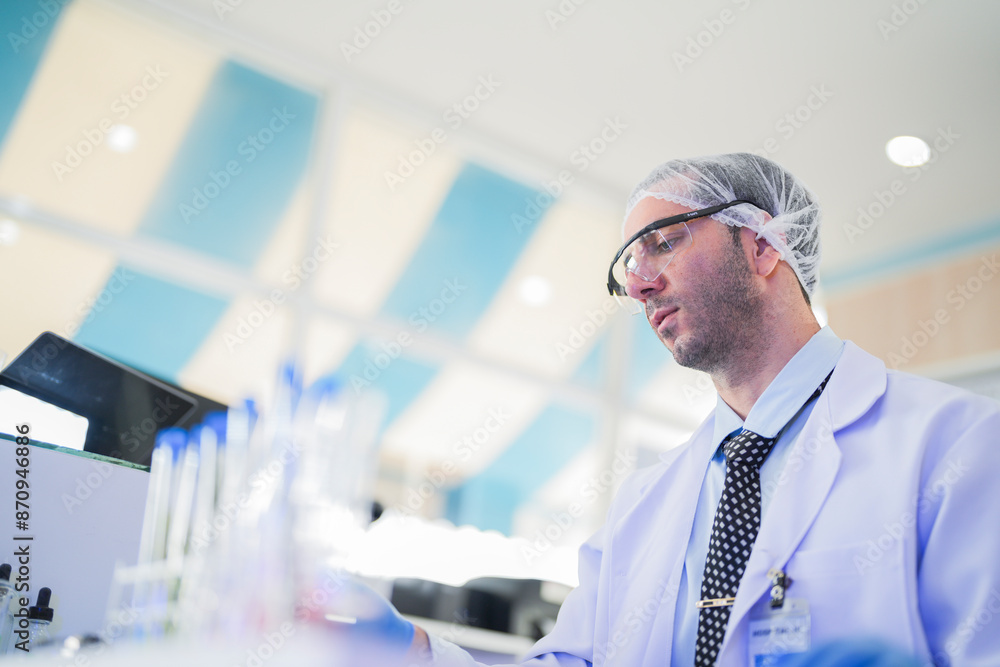 esteemed scientist man elegantly dressed in lab coats are meticulously testing chemicals innovative serums and cutting edge antibiotics to pioneer treatments for humans. crafting dietary supplements. esteemed scientist man elegantly dressed in lab coats are meticulously testing chemicals innovative serums and cutting edge antibiotics to pioneer treatments for humans. crafting dietary supplements.