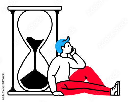 Man sitting and waiting next to hourglass