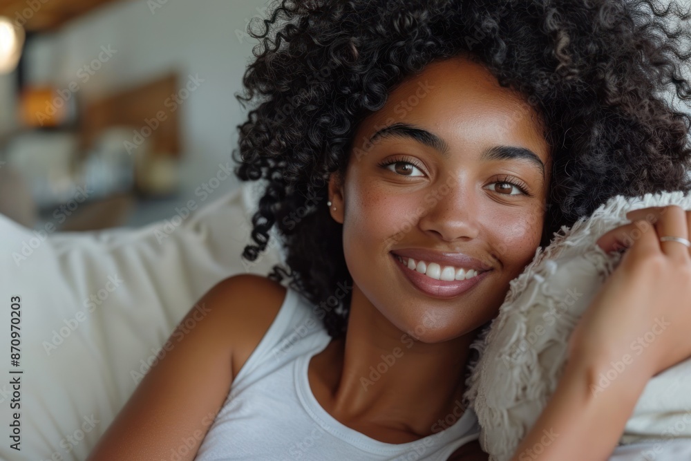 happy young african american woman relaxing and lying on the sofa at home. ai generative