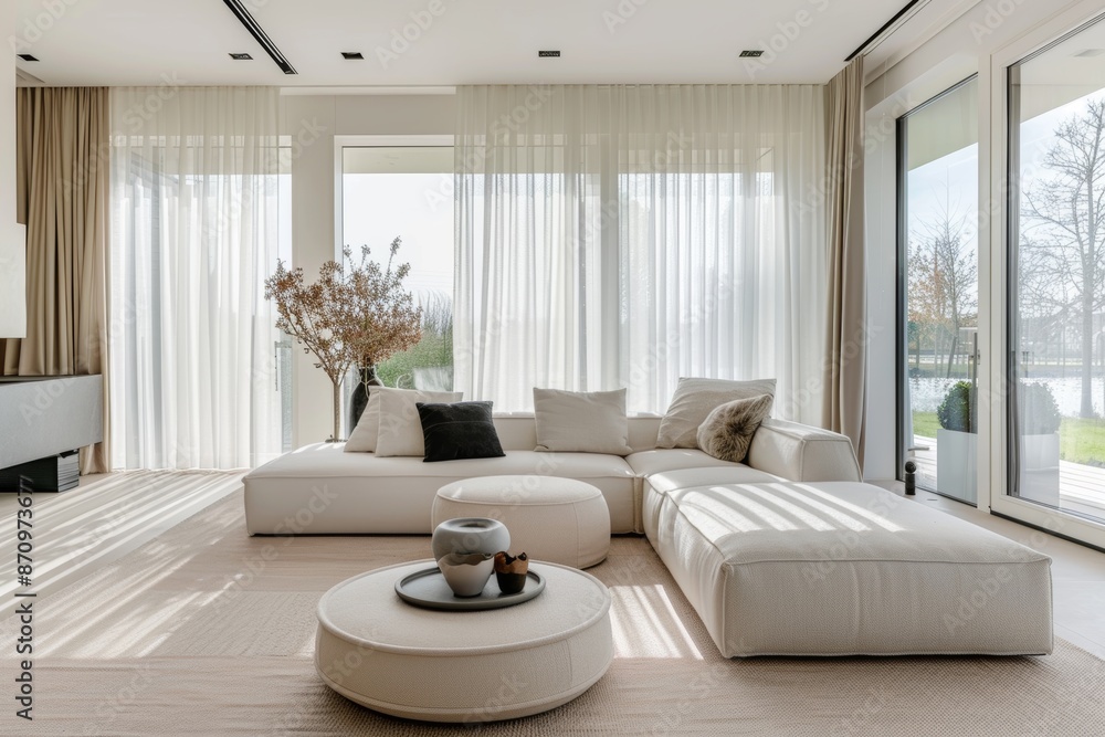 Fototapeta premium Modern Living Room with Minimalist Decor and Large Windows Flooded with Natural Light