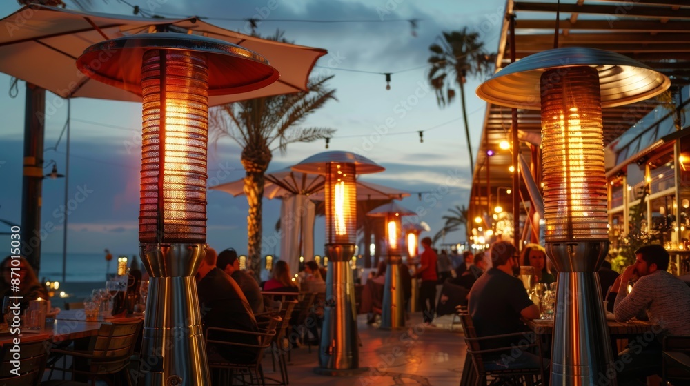 Beachside Restaurant with Outdoor Heaters Creating a Cozy Evening Atmosphere Beachside Restaurant with Outdoor Heaters Creating a Cozy Evening Atmosphere