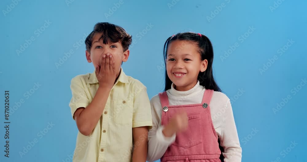 Children, whisper and gossip with secret in studio with for trust or friendship on a blue background. Sneaky little boy, girl or kids telling rumour in ear with surprise or reaction for news or lie Children, whisper and gossip with secret in studio with for trust or friendship on a blue background. Sneaky little boy, girl or kids telling rumour in ear with surprise or reaction for news or lie