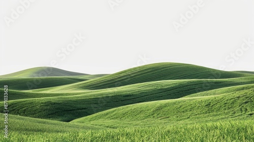 Field of green grass with rolling hills in the background, suitable for outdoor or landscape use