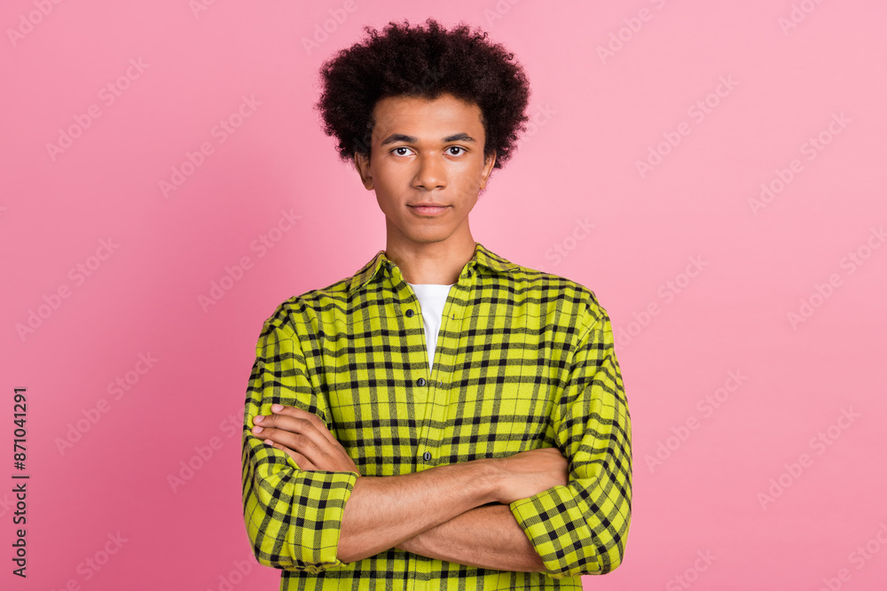 Photo of nice young man folded arms wear shirt isolated on pink color background Photo of nice young man folded arms wear shirt isolated on pink color background