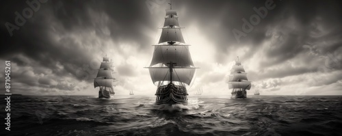 Black and white illustration of Columbuss three ships sailing on the open ocean photo