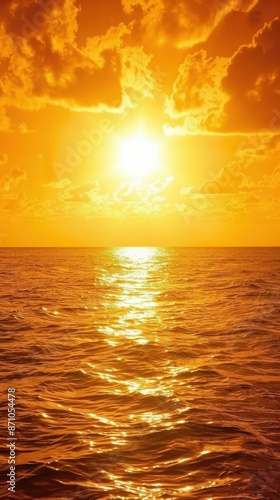 sunset over the ocean with a boat in the water