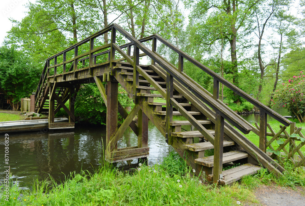 Traditional wooden bridge over a small river in the german Spreewald region Traditional wooden bridge over a small river in the german Spreewald region