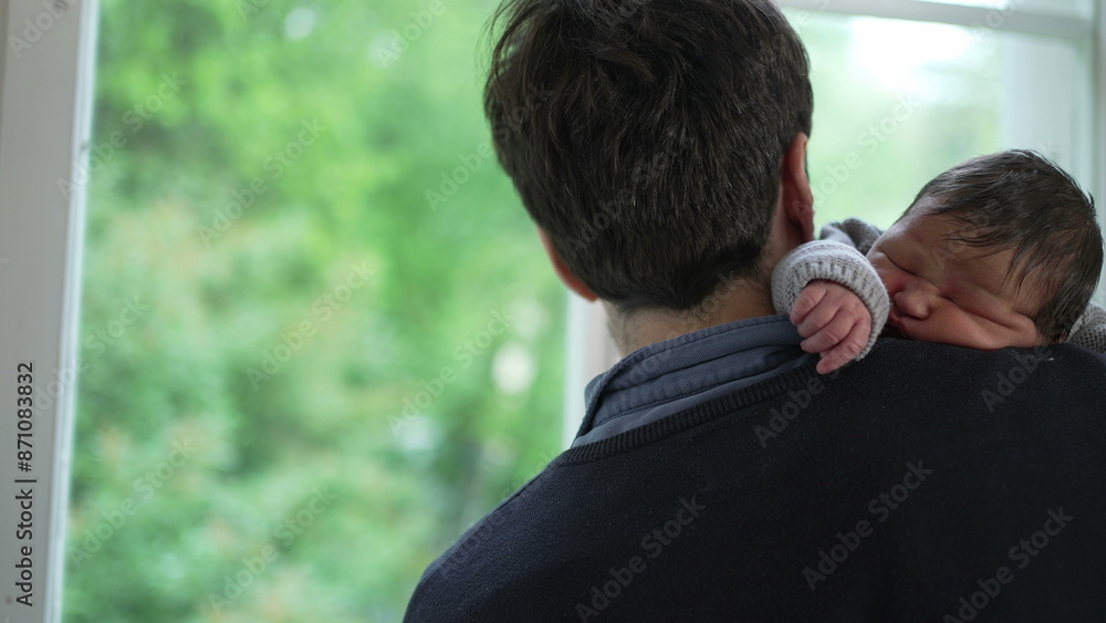 Happy Father holding his newborn baby on his shoulder, smiling warmly at the camera. showcasing a tender moment of paternal love and care Happy Father holding his newborn baby on his shoulder, smiling warmly at the camera. showcasing a tender moment of paternal love and care