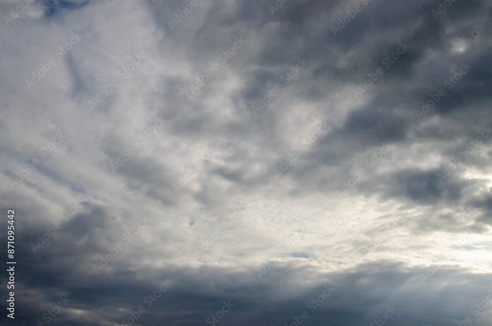 White passenger airplane flying in the sky amazing clouds in the background White passenger airplane flying in the sky amazing clouds in the background