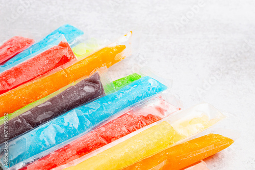 Rainbow Frozen Ice Pop Rainbow Frozen Ice Pop Popsciple on a Kitchen Countertop  on a Kitchen Countertop