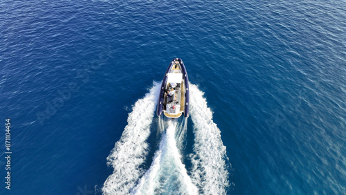 Obraz na płótnie Aerial drone top down photo of luxury inflatable rib speed boat cruising in mediterranean sea w salonie