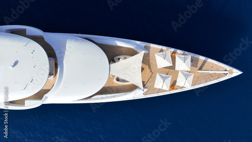 Obraz na płótnie Aerial drone top down photo of luxury super yacht with wooden deck anchored in paradise exotic deep blue sea island bay w salonie
