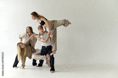 A team of young dancers dancing in white location
 photo