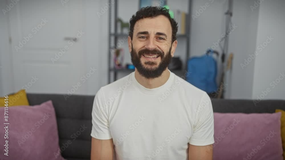 Confident mature man, radiates positivity in white t-shirt. his stunning happy face flaunts a cool smile, enhancing the cheerful atmosphere at home. Confident mature man, radiates positivity in white t-shirt. his stunning happy face flaunts a cool smile, enhancing the cheerful atmosphere at home.