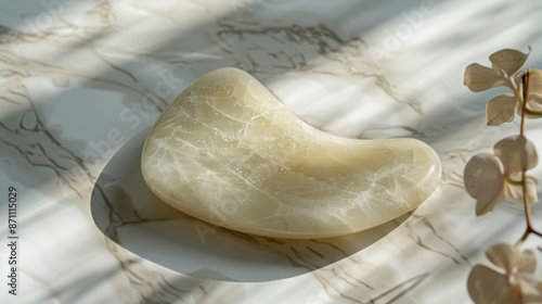 Wallpaper Mural White Jade Gua Sha Tool on Marble Surface With Flower Stem Torontodigital.ca