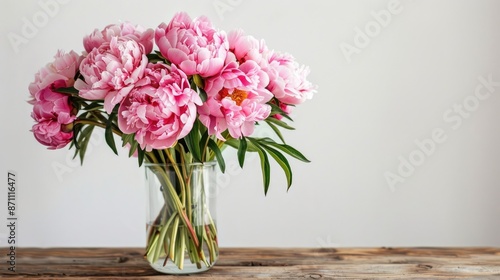 Wallpaper Mural Pink peonies bouquet on wooden table against white wall ideal for events floral arrangement Torontodigital.ca