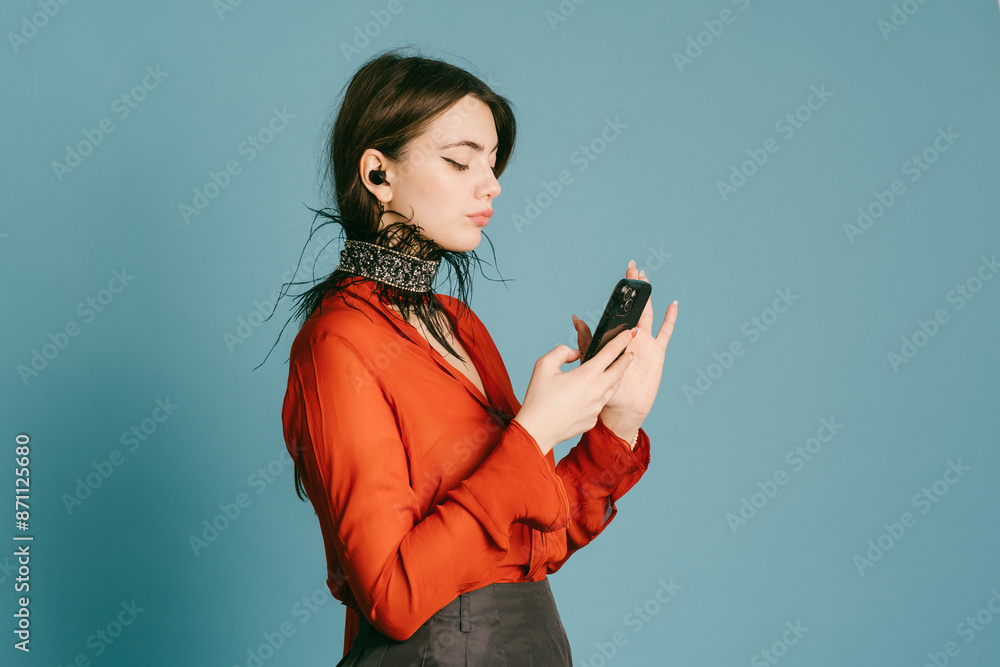 Stylish Woman Engaged with Smartphone Stylish Woman Engaged with Smartphone
