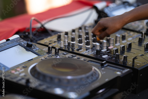 close up to the dj hands with mixing console at the open air african festival in Lisbon