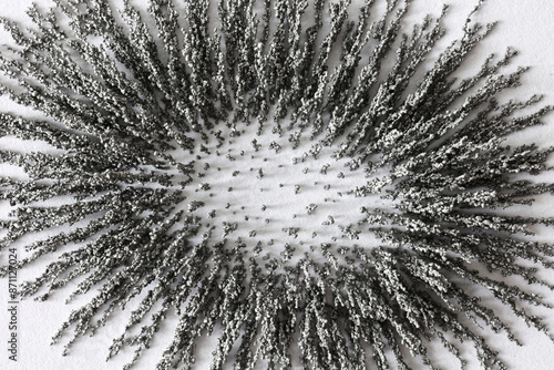 Iron powder in magnetic field abstract background
