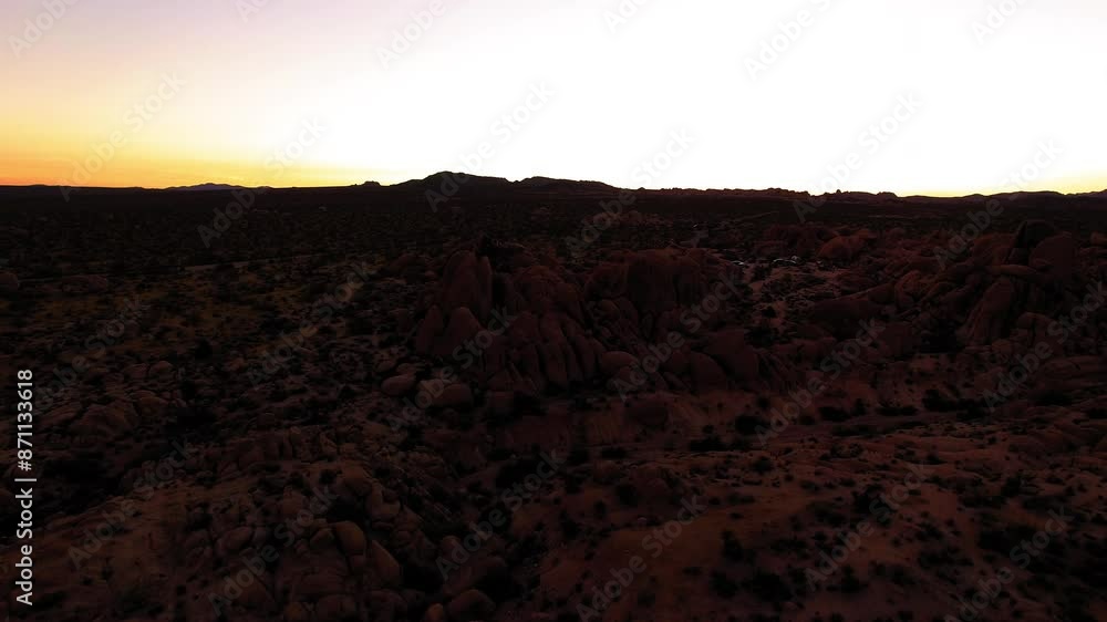 Aerial Scenic Shot Of Semi Arid Joshua National Park Against Clear Sky, Drone Flying Forward During Sunset - Joshua Tree, California Aerial Scenic Shot Of Semi Arid Joshua National Park Against Clear Sky, Drone Flying Forward During Sunset - Joshua Tree, California