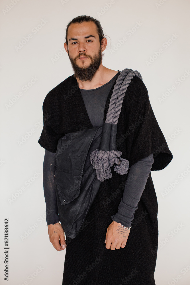 Fashion portrait of brunette man with big bag Fashion portrait of brunette man with big bag