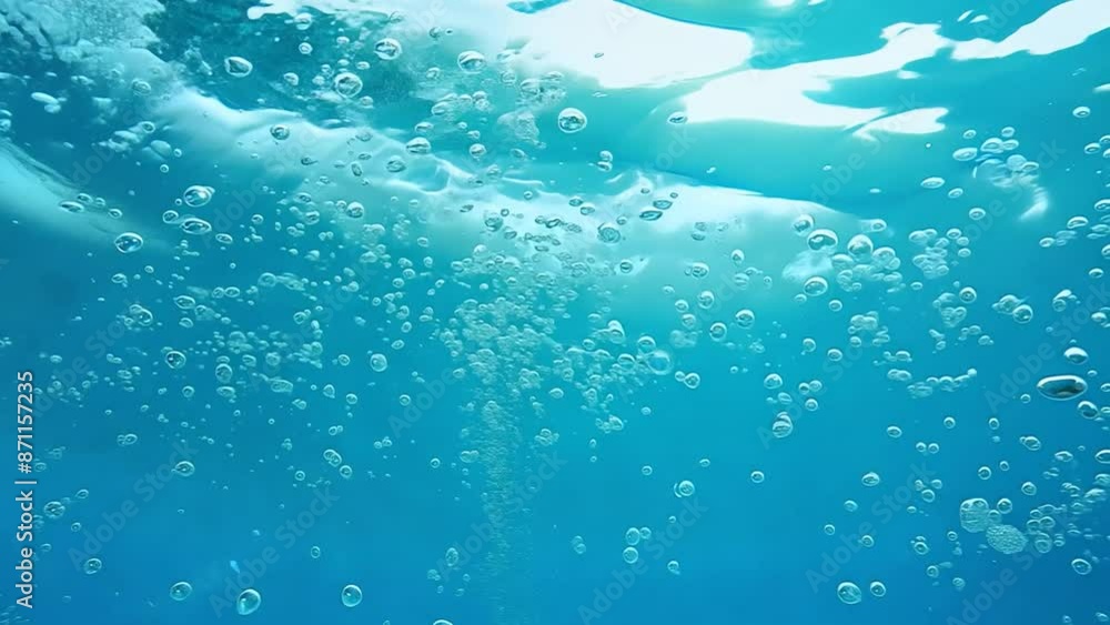 A close-up shot of air bubbles rising through clear blue water, creating a beautiful, abstract pattern A close-up shot of air bubbles rising through clear blue water, creating a beautiful, abstract pattern