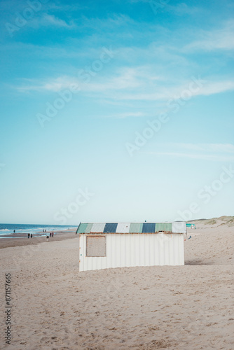 Beach shed on the sandy shore by the sea. Noordwijk, Netherlands photo