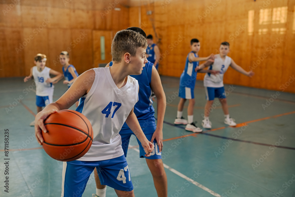 Teen basketball player dribbling past an opponent Teen basketball player dribbling past an opponent