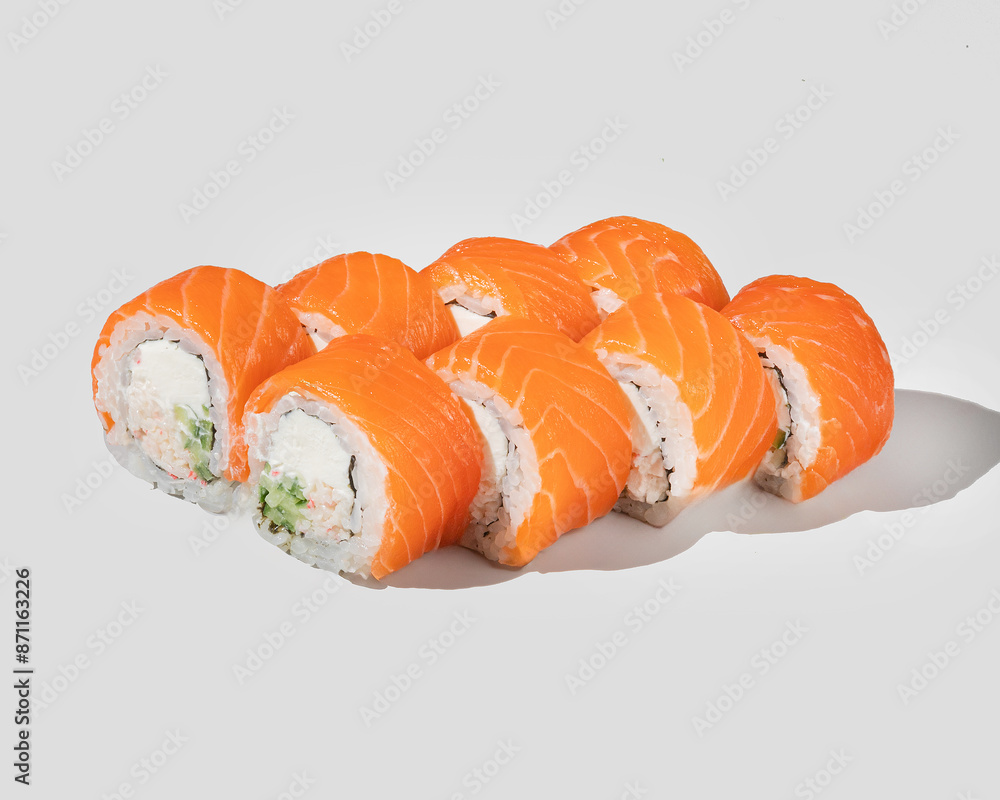Fresh salmon sushi rolls on a white background, perfect for Japanese cuisine concepts or celebrating International Sushi Day Fresh salmon sushi rolls on a white background, perfect for Japanese cuisine concepts or celebrating International Sushi Day