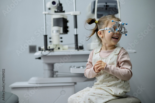 Little girl checking up her sight at ophthalmology center
