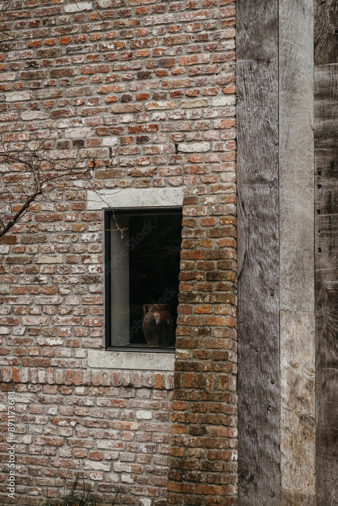 Rustic window on a weathered brick wall Rustic window on a weathered brick wall