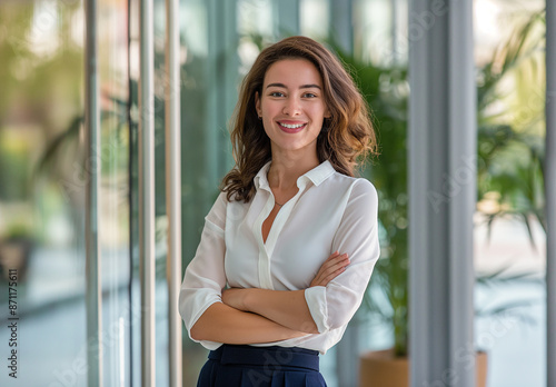 Free Download A portrait of an attractive business woman standing in front of her office - GFXLoad