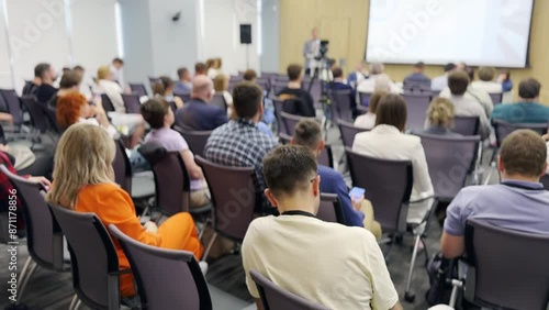 Wallpaper Mural Large group of people attending a business conference in a modern lecture hall. Participants are engaged and listening to a speaker. Torontodigital.ca