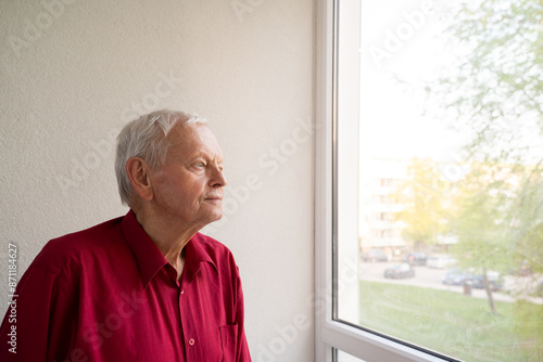 Old Man Looking Through The Window photo