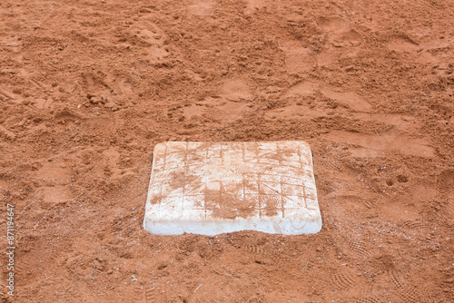 Dirty Baseball Base with Cleat Marks in the Dirt