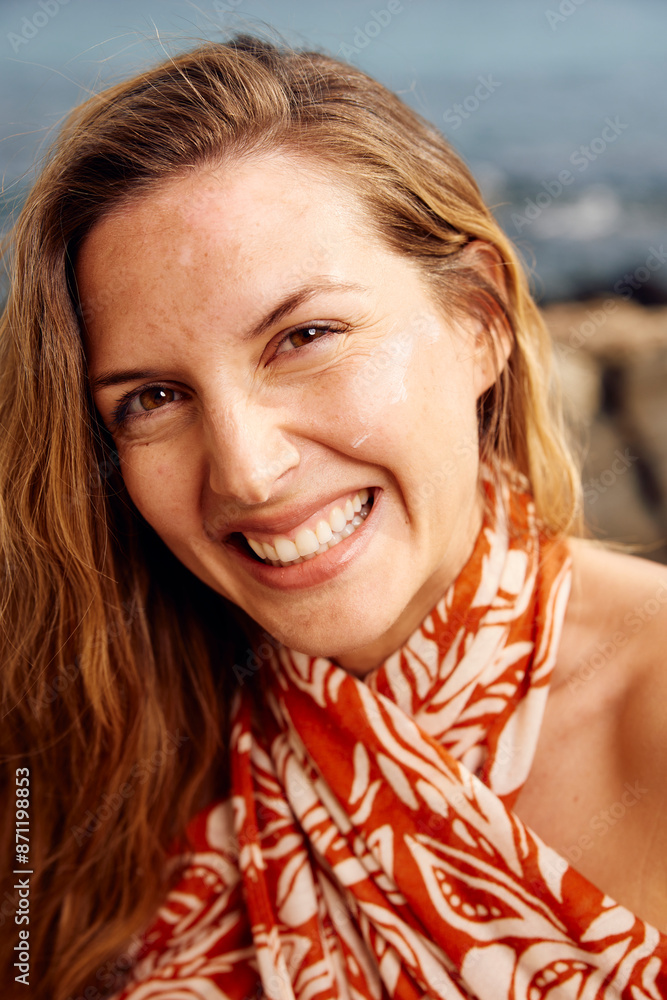 Portrait of a smiling brunette by the sea Portrait of a smiling brunette by the sea