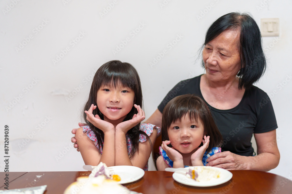 children and birthday cake with grandma children and birthday cake with grandma