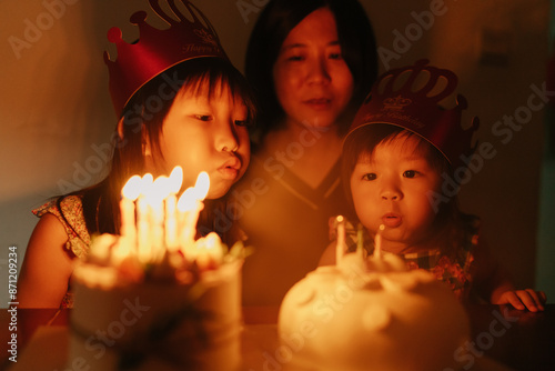 child and birthday cake with candles photo