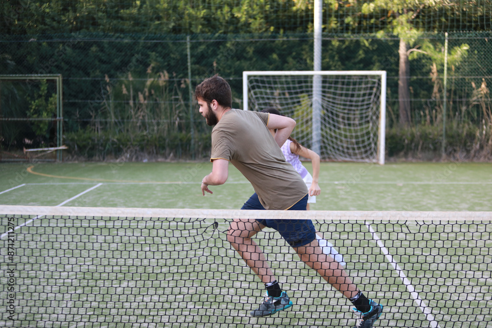 Fototapeta premium Coach And Tennis Student Running Together 