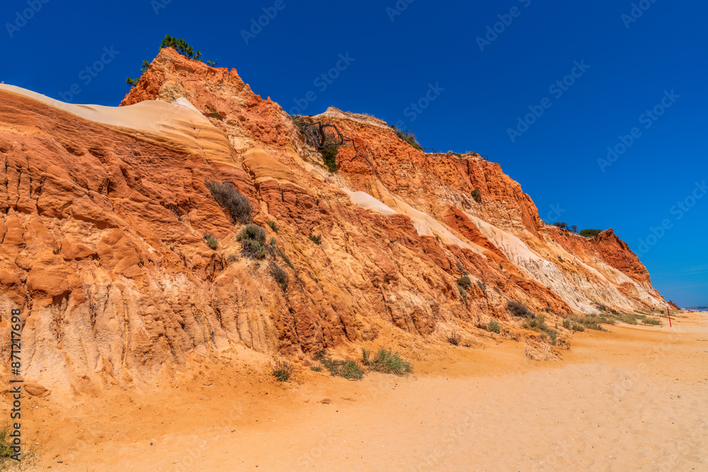 Colourful cliffs Algarve Portugal Falesia beach with red rocks and golden sand near Vilamoura and Albufeira Colourful cliffs Algarve Portugal Falesia beach with red rocks and golden sand near Vilamoura and Albufeira
