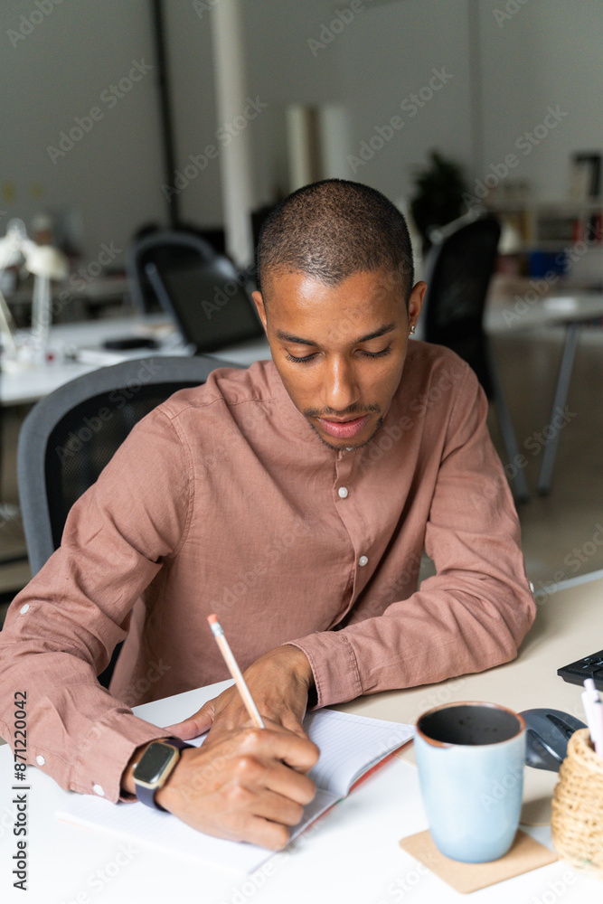 Queer man working at office Queer man working at office