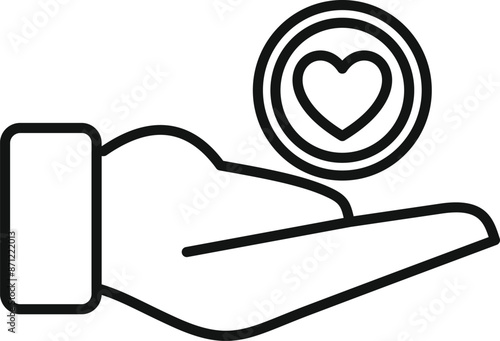 Hand is holding a coin with a heart shape representing a donation or charitable giving