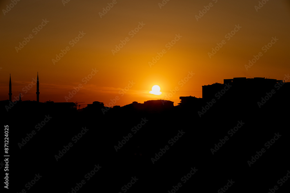 Silhouette of City Skyline with Minarets at Sunset Silhouette of City Skyline with Minarets at Sunset