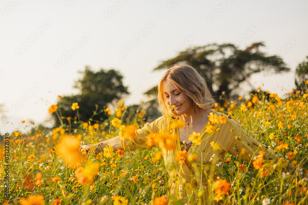 Charming woman enjoying blooming flowers Charming woman enjoying blooming flowers