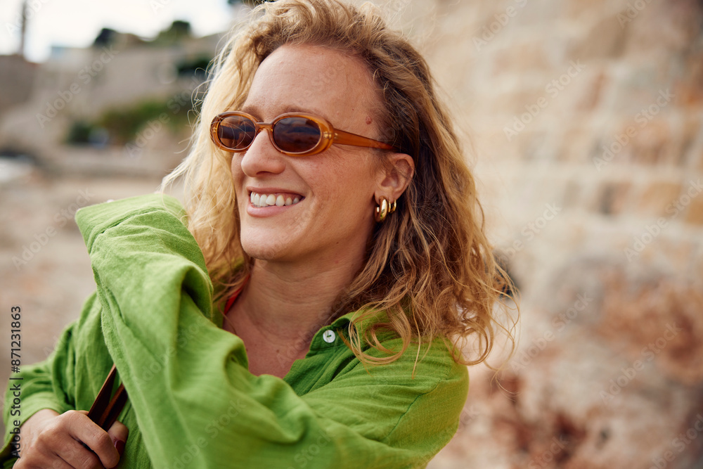 Portrait of a smiling woman with sunglasses Portrait of a smiling woman with sunglasses