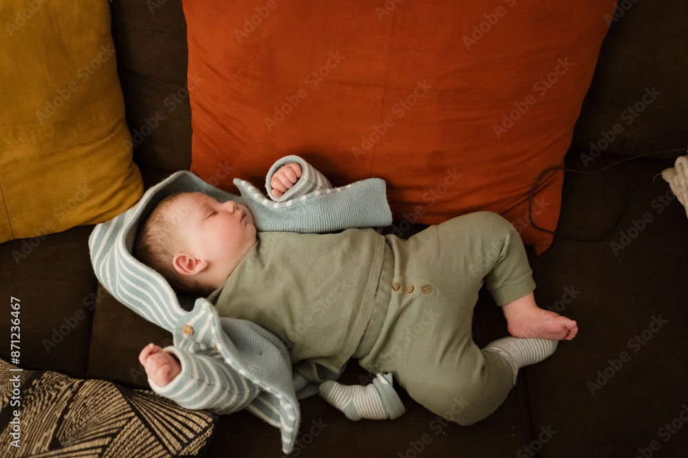 A baby sleeping on the sofa at home A baby sleeping on the sofa at home
