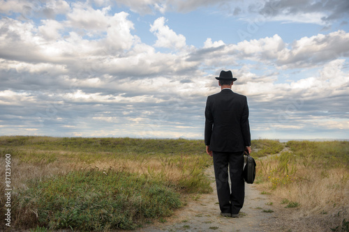 Businessman standing on a path