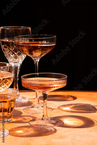 Coupes and stemware with rosé wine
