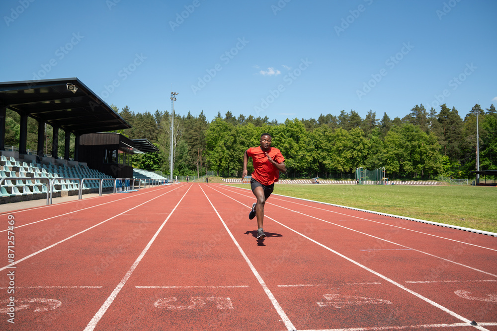 Black Athlete Running In Stadium Outdoors Black Athlete Running In Stadium Outdoors